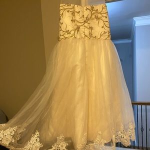 Beautiful dress with gold work And net And flowers